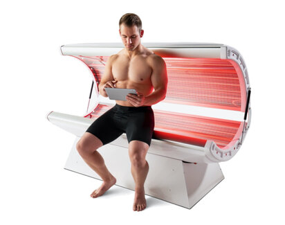 Photo of man in red light therapy bed